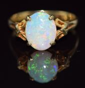 A 14k gold ring set with an oval opal cabochon, 2.5g, size N