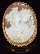 A yellow metal brooch set with a cameo in a rope twist border, 5.5 x 4cm