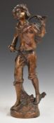 Bronze or similar figure of a boy carrying a basket on a stick, H36.5cm
