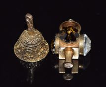 Two 9ct gold charms, one in the form of a bell and the other a lamp, 9.4g