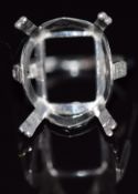 A platinum ring mount set with a baguette cut diamond, 8.1g, size M