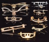 Eight gold brooch fittings, 14.8g