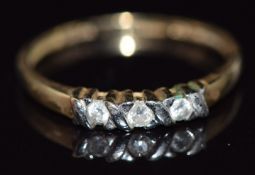 A 9ct gold ring set with three diamonds, total diamond weight approximately 0.1ct, 1.3g, size O