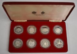 Eight Spink and Son cased Queen Elizabeth II commemorative silver crowns, various islands