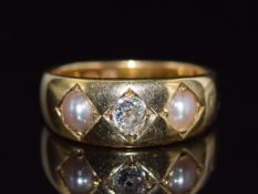 Victorian 18ct gold ring set with an old cut diamond of approximately 0.2ct and two split pearls,