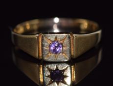 An 18ct gold ring set with an amethyst in a star setting, 4.1g, size T