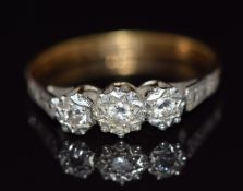 An 18ct gold ring set with diamonds in a platinum setting, 3.1g, size P