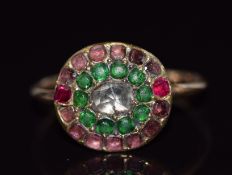 Georgian ring set with a rose cut diamond, two rubies, garnets and emeralds, size K