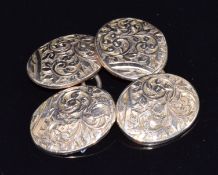 A pair of 9ct gold cufflinks with embossed foliate decoration, 3.8g