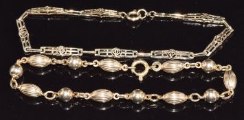Two 9ct gold bracelets, one made up of sphere and barrel shaped links, 9.3g