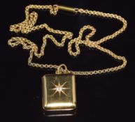 An Edwardian 18ct gold necklace / chain with an 18ct gold locket set with a diamond in a star