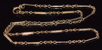 A 9ct gold necklace c1900, made up of knotted and elongated links, 21.2g, 62cm long