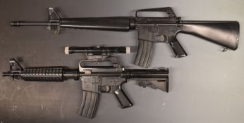 Two ASGK Colt Ar-15 assault rifle airsoft BB guns, one with 4x20 scope and tactical stock.