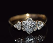 An 18ct gold ring set with diamonds in a platinum cluster, 2.4g, size M