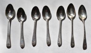 Seven Georgian and later Irish hallmarked silver teapoons with bright cut decoration, four Dublin