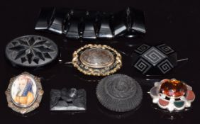 Three Victorian jet brooches, a jet bracelet, Victorian mourning brooch, silver pendant/ brooch