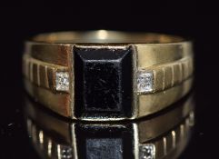 A 9ct gold ring set with diamonds and onyx, 3.4g, size U