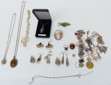 A collection of silver jewellery including bracelets, necklaces, pendants, cameo brooch, etc