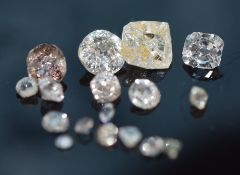 Six loose cut diamonds, a loose uncut diamond and a quantity of small diamonds