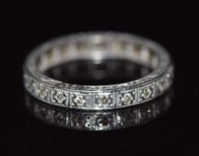 An 18ct white gold eternity ring set with diamonds, 3.5g, size L/M