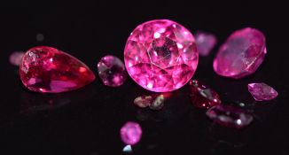 A loose cushion cut Burmese ruby, pear cut ruby, round cut synthetic ruby, small rubies and pink