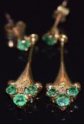 A pair of 9ct gold earrings set with emeralds and diamonds, 1.9g, 2cm long