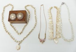 A collection of jewellery including two silver brooches set with mother of pearl, in wooden box,
