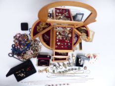 A collection of costume jewellery including silver cross, bracelet and rings, watches, pendants,