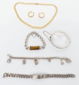 A silver bangle, silver bracelet set with tiger's eye, silver charm bracelet and a suite of Monet