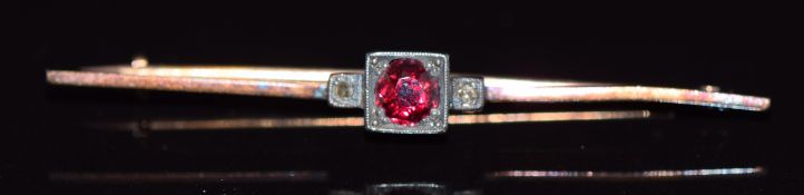 A 15ct gold brooch set with a synthetic ruby and diamond, 3g, 5cm long