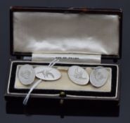 A pair of silver cufflinks with engraved partridge and snipe
