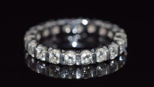 A platinum eternity ring set with 20 round cut diamonds each approximately 0.1ct, made by Mappin and