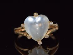 Victorian ring set with a heart cut moonstone cabochon surrounded by diamonds, size R, 5g