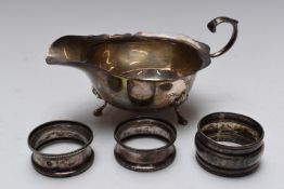 Elkington & Co. Elizabeth II hallmarked silver sauce boat with shaped edge, raised on three feet,