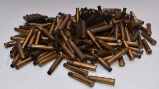 A collection of brass .303 rifle cartridge cases and clips.