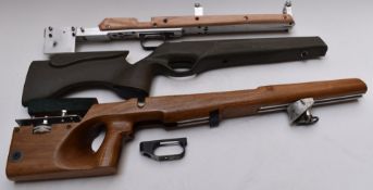 Three target rifle stocks including one composite BSA and one with adjustable cheek piece together