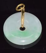 A jade bi disc with 18ct gold pendant mount, 2.3cm diameter