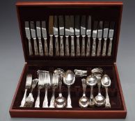 An eight place setting of King's pattern cutlery, width of canteen 44.5cm
