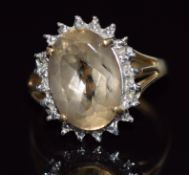 A 9ct gold ring set with an oval cut quartz, 4.1g, size O