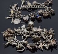 Two silver charm bracelets with over 37 charms including donkey, dog, cow, horse, cauldron with