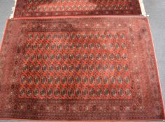 Turkoman rug and matching runner with multiple guls on a wine ground