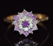 A 9ct gold ring set with amethysts and diamonds, 2g, size N