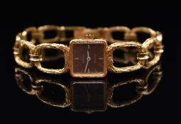 Omega 18ct gold ladies wristwatch with white hands and hour markers, textured dial and signed 17