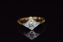 An 18ct gold ring set with diamonds in a platinum setting, 2.8g, size L