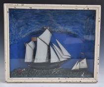 A 19thC diorama of two sailing ships, probably painted metal, in glazed case, 31x38cm