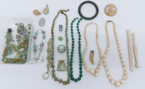 A nephrite jade bangle, quartz beads, ivory beaded necklaces, etc