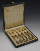 Cased set of Art Nouveau / Vienna Secessionist white metal handled pastry forks with gilt tines, the