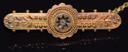 A 15ct gold brooch set with a diamond, 3.7cm long, 3.1g