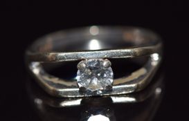 An 18ct white gold ring set with a round cut diamond of approximately 0.4ct, 4g, size L/M