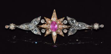 Victorian brooch set with an oval cut pink sapphire of approximately 0.5ct surrounded by rose cut
